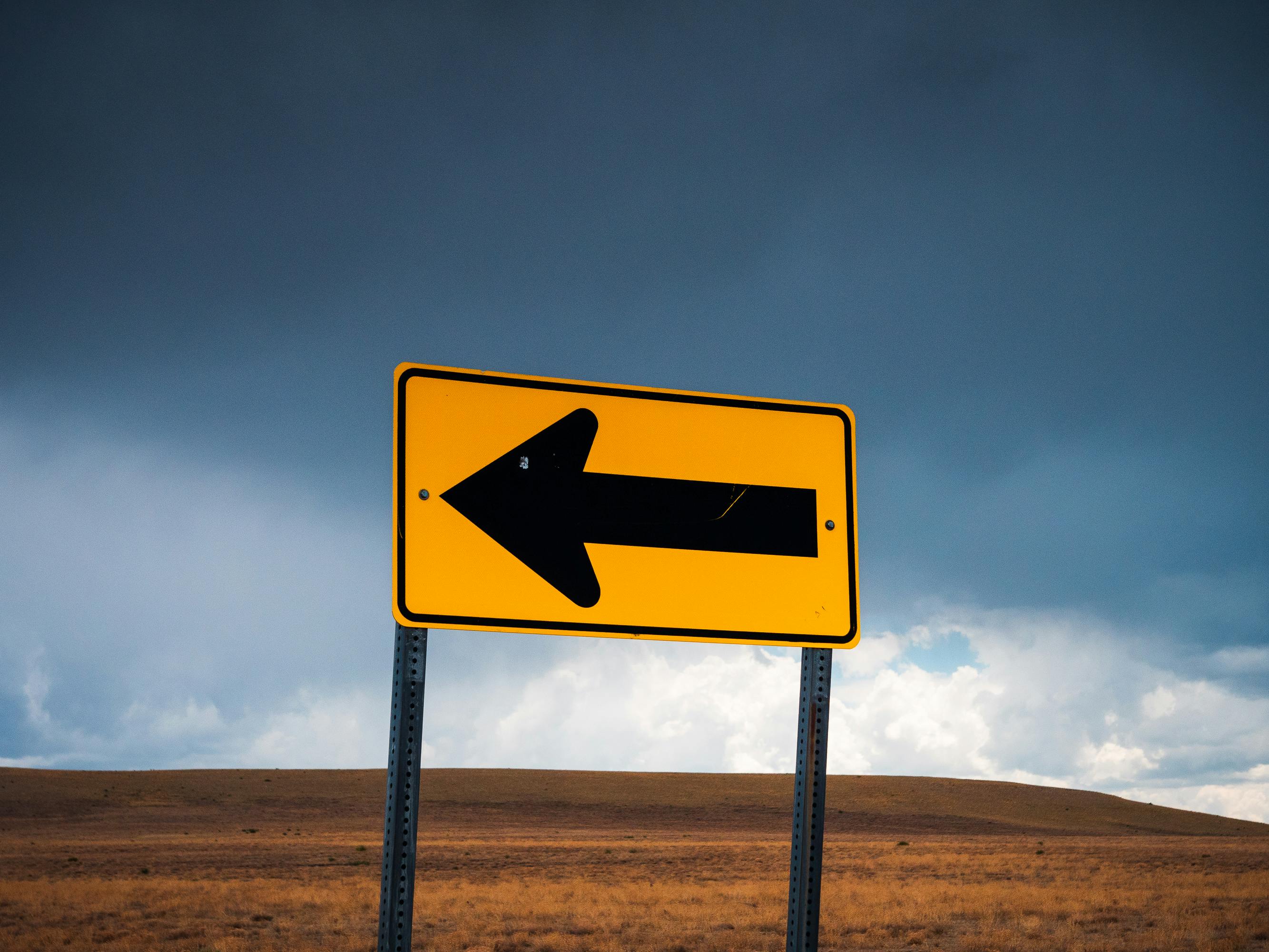 Road sign with an arrow representing website redirects and migration paths